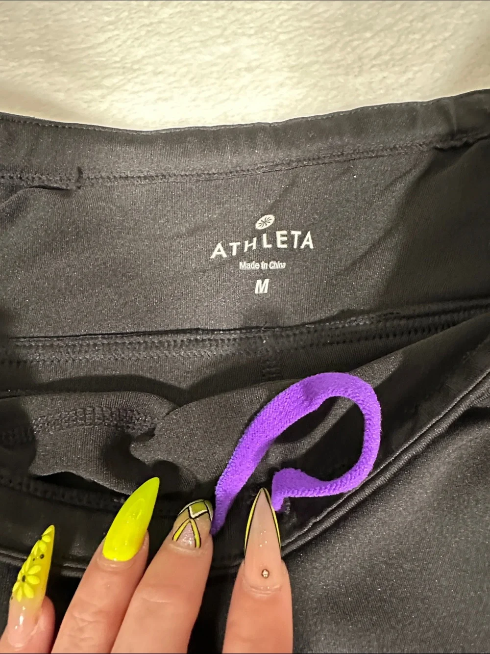 Athleta Black Presto Bermuda compression shorts with Purple Accent